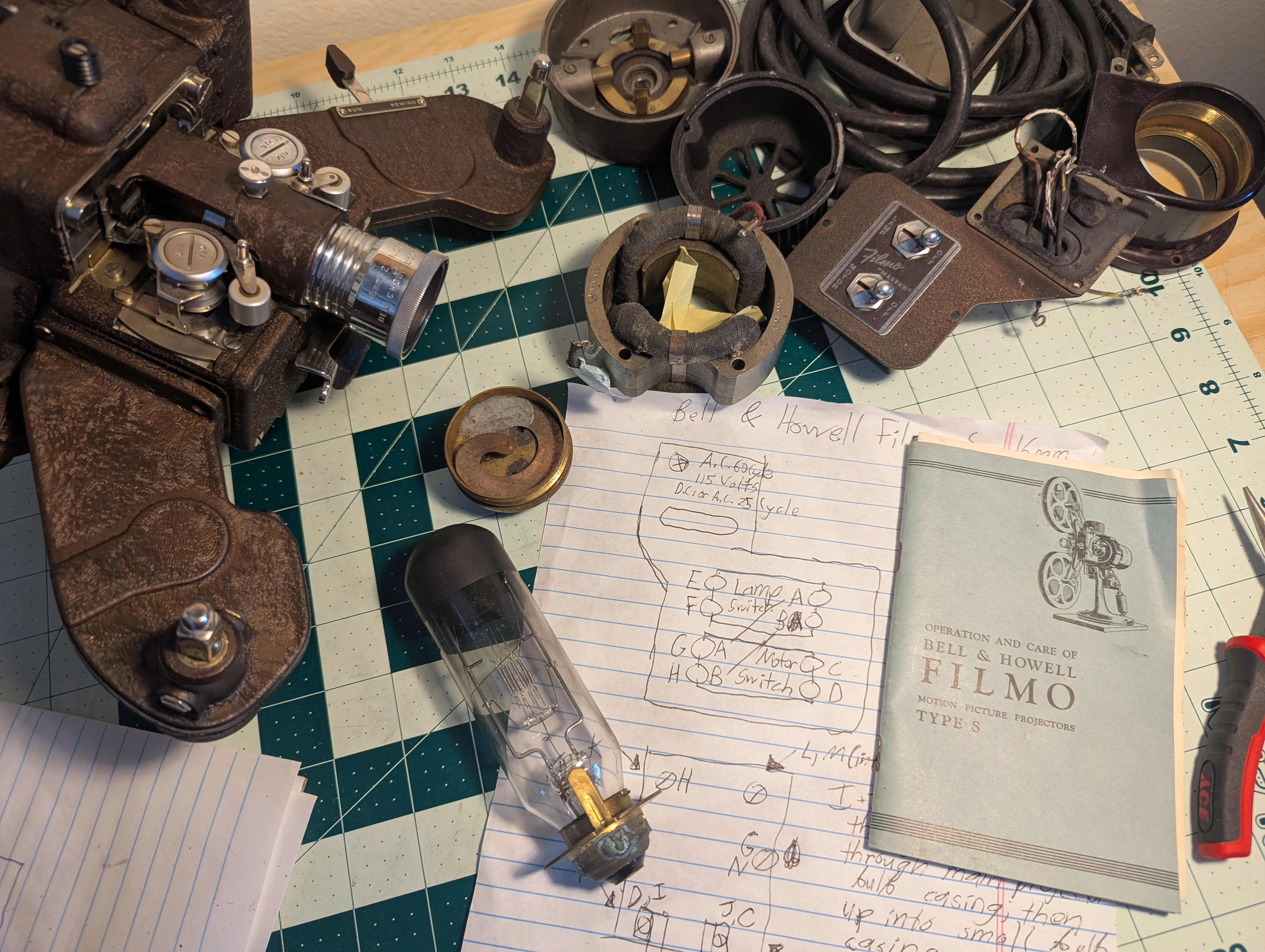 Photo of various unassembled Filmo Projector Parts